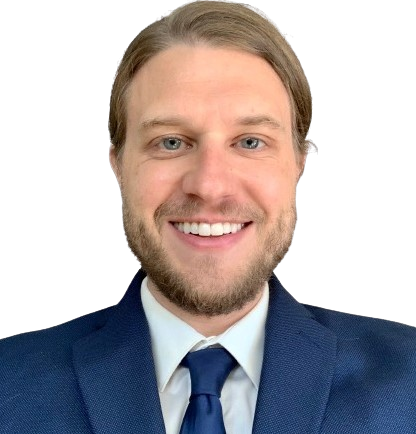 Portrait of Harry Smith, a software engineer, who is smiling towards the camera. He is well-lit, wearing professional attire.